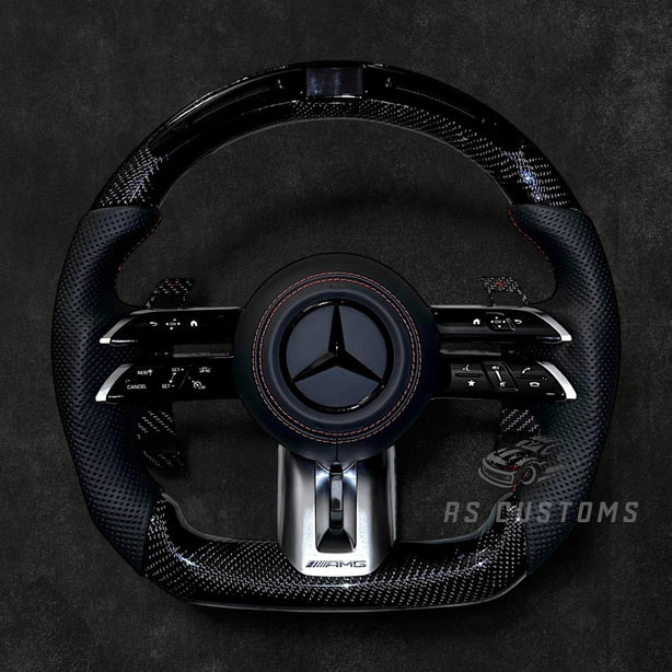 RS Customs Mercedes-AMG Dragonfly custom steering wheel with carbon fiber, perforated leather grips, LED display, multifunction buttons and optional full airbag for Mercedes-Benz models from 2014+.