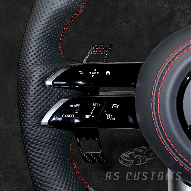 RS Customs Mercedes-AMG Dragonfly custom steering wheel with carbon fiber, perforated leather grips, LED display, multifunction buttons and optional full airbag for Mercedes-Benz models from 2014+.