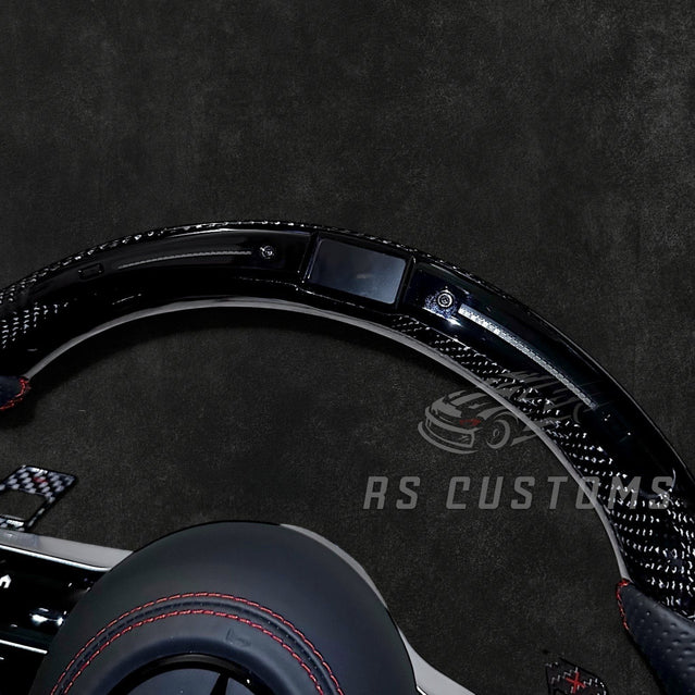 RS Customs Mercedes-AMG Dragonfly custom steering wheel with carbon fiber, perforated leather grips, LED display, multifunction buttons and optional full airbag for Mercedes-Benz models from 2014+.