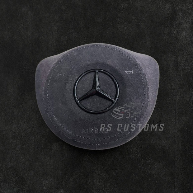 RS Customs Mercedes-Benz custom airbag cover for 2016–2018 models available in leather or Alcantara with custom stitching and chrome or black Mercedes-Benz logo options.