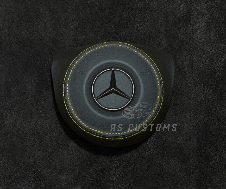 Custom MercedesRS Customs Mercedes-Benz custom airbag cover for 2016–2018 models available in leather or Alcantara with custom stitching and chrome or black Mercedes-Benz logo options.Airbag 2016 2018