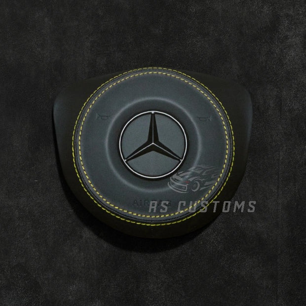 Custom MercedesRS Customs Mercedes-Benz custom airbag cover for 2016–2018 models available in leather or Alcantara with custom stitching and chrome or black Mercedes-Benz logo options.Airbag 2016 2018