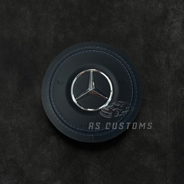RS Customs Mercedes-Benz custom airbag cover for 2018–2022 models available in leather or Alcantara with custom stitching and chrome or black Mercedes-Benz logo options.