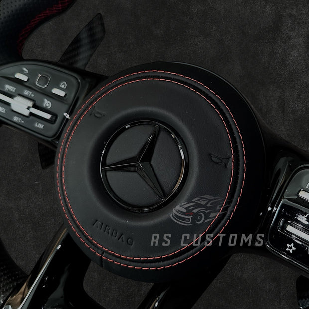 RS Customs Mercedes W205 W213 W222 W463A AMG custom steering wheel with carbon fiber, perforated leather grips and LED display for C-Class, E-Class, S-Class and G-Class models.