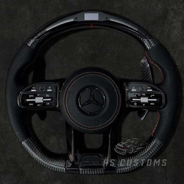 RS Customs Mercedes W205 W213 W222 W463A AMG custom steering wheel with carbon fiber, perforated leather grips and LED display for C-Class, E-Class, S-Class and G-Class models.