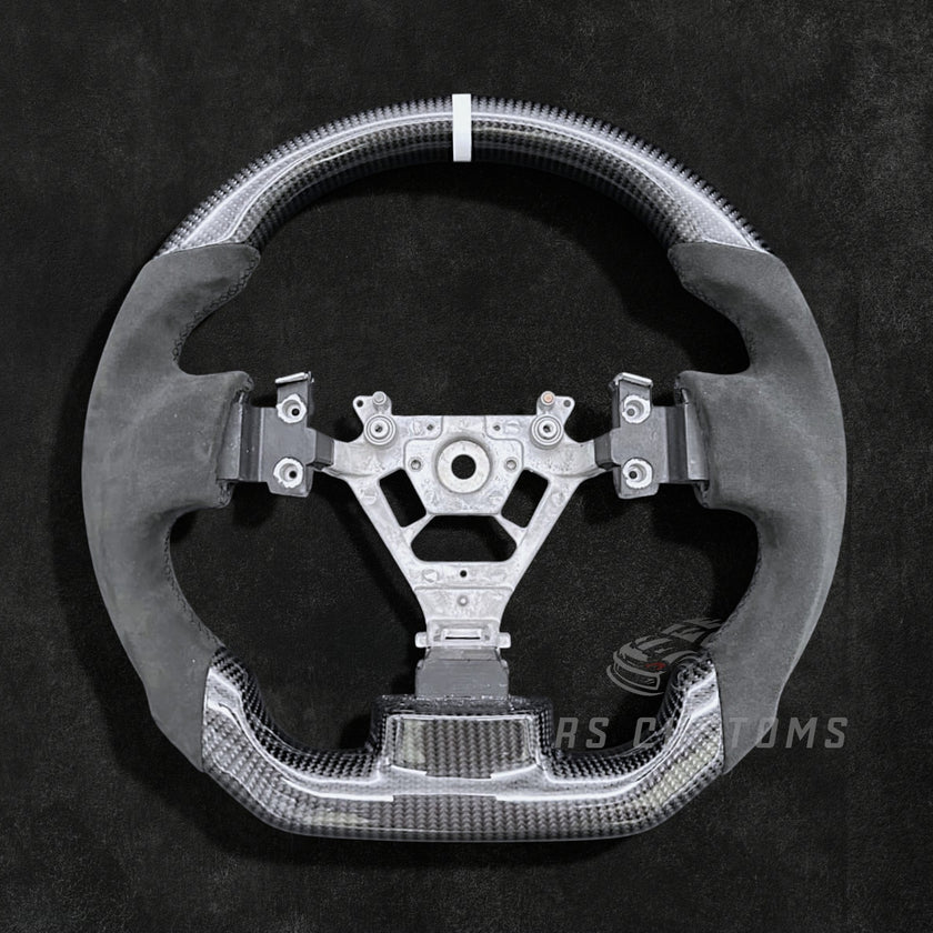 RS Customs Nissan 350Z custom steering wheel with carbon fiber, Alcantara grips, optional carbon trim cover and custom leather or Alcantara airbag cover for Z33 models.