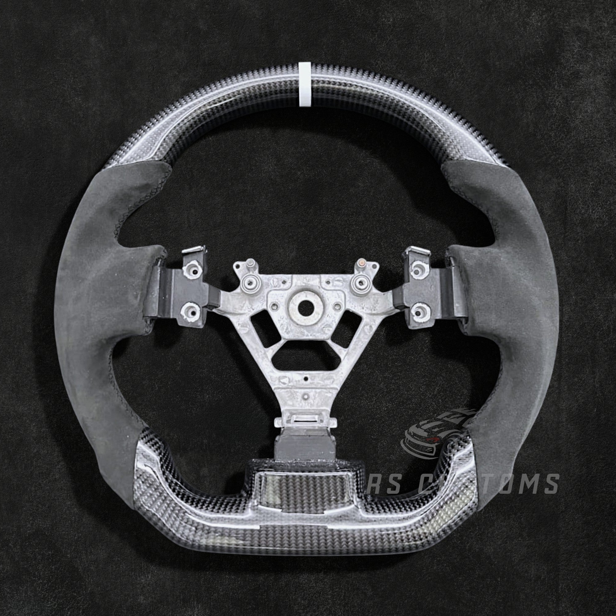RS Customs Nissan 350Z custom steering wheel with carbon fiber, Alcantara grips, optional carbon trim cover and custom leather or Alcantara airbag cover for Z33 models.