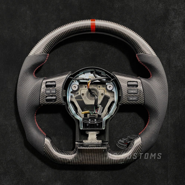 RS Customs Nissan 350Z custom steering wheel with carbon fiber, perforated leather grips, carbon trim and optional leather or Alcantara airbag cover for Z33 models.