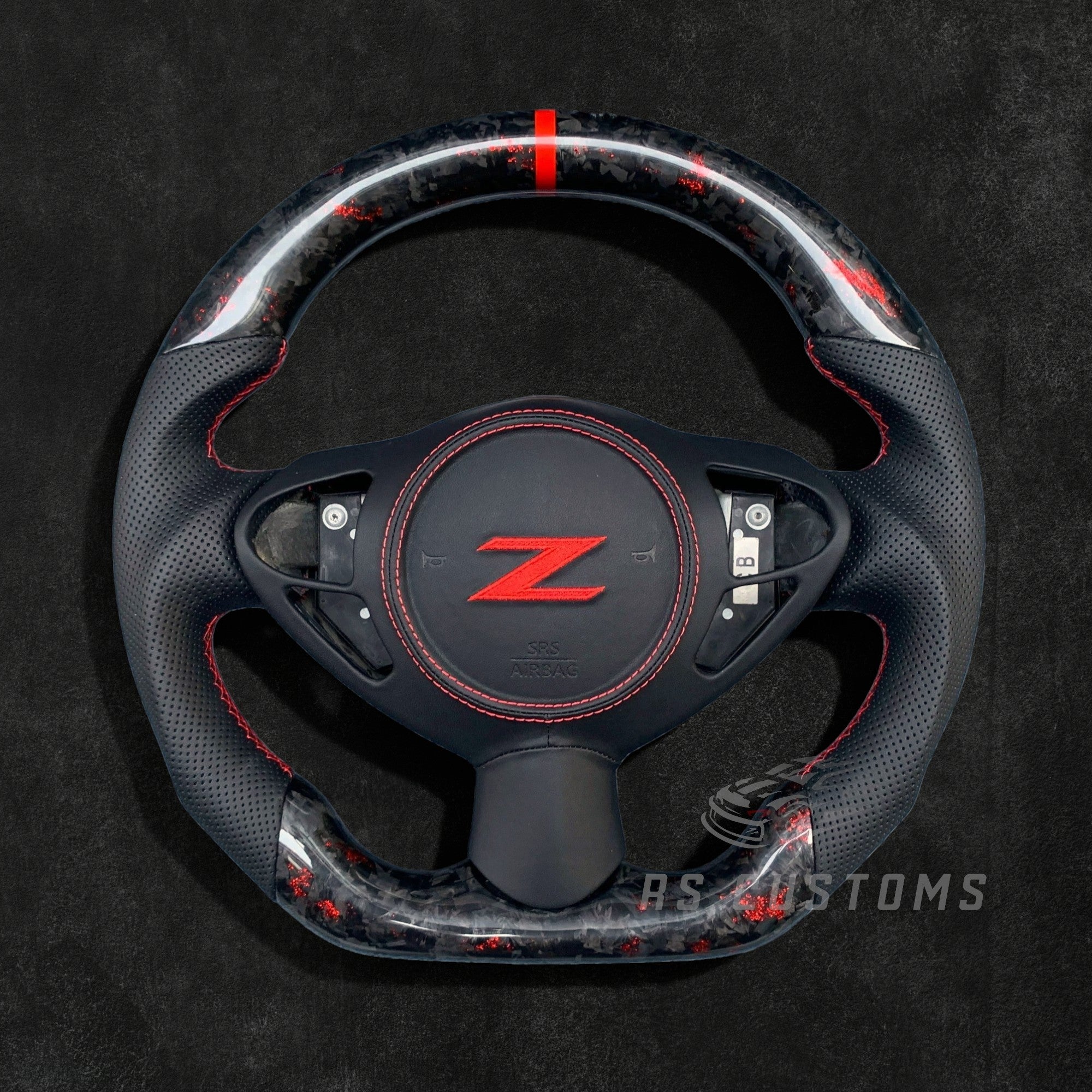 RS Customs Nissan 370Z custom steering wheel with forged carbon fiber, colored flakes, leather grips and optional custom airbag cover for Z34 models