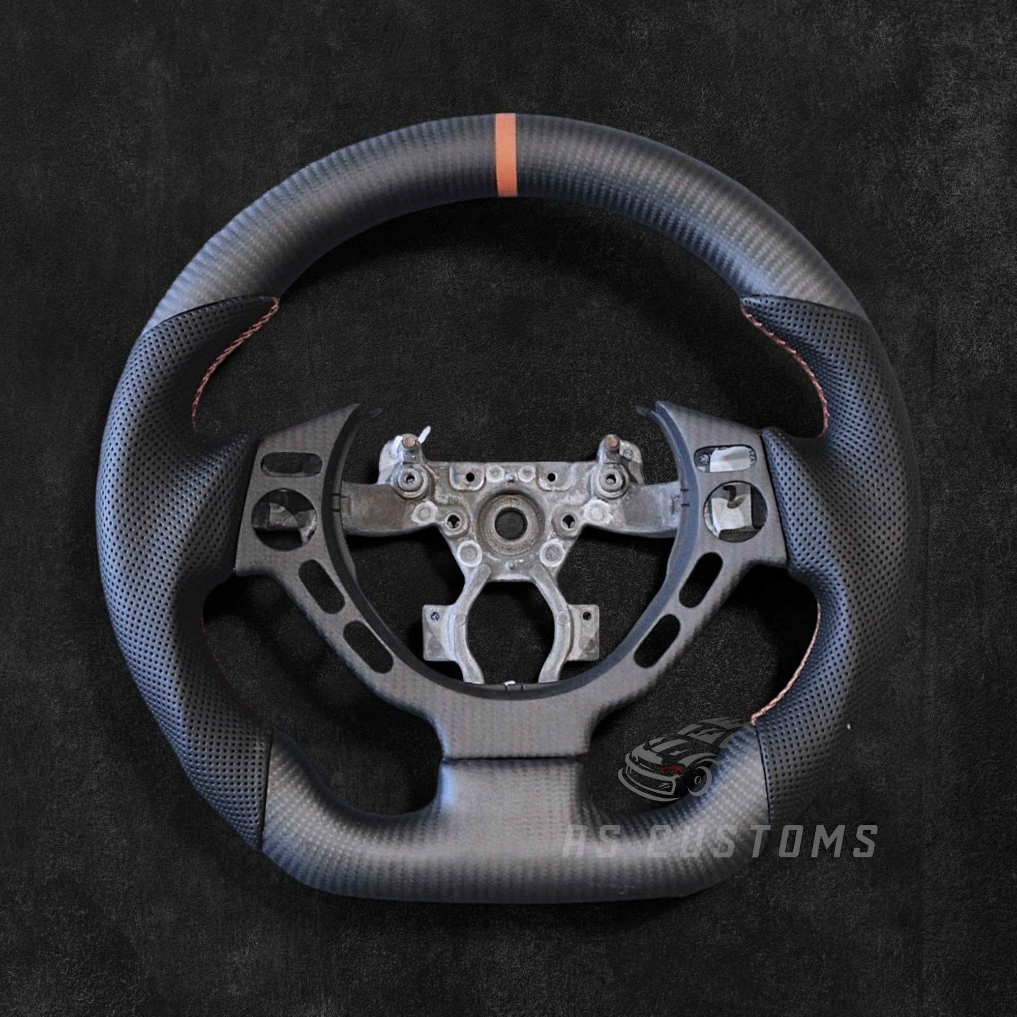 RS Customs Nissan GT-R R35 Pre-Facelift custom steering wheel with carbon fiber, perforated leather grips and optional leather or Alcantara airbag cover for 2008–2016 GT-R models.