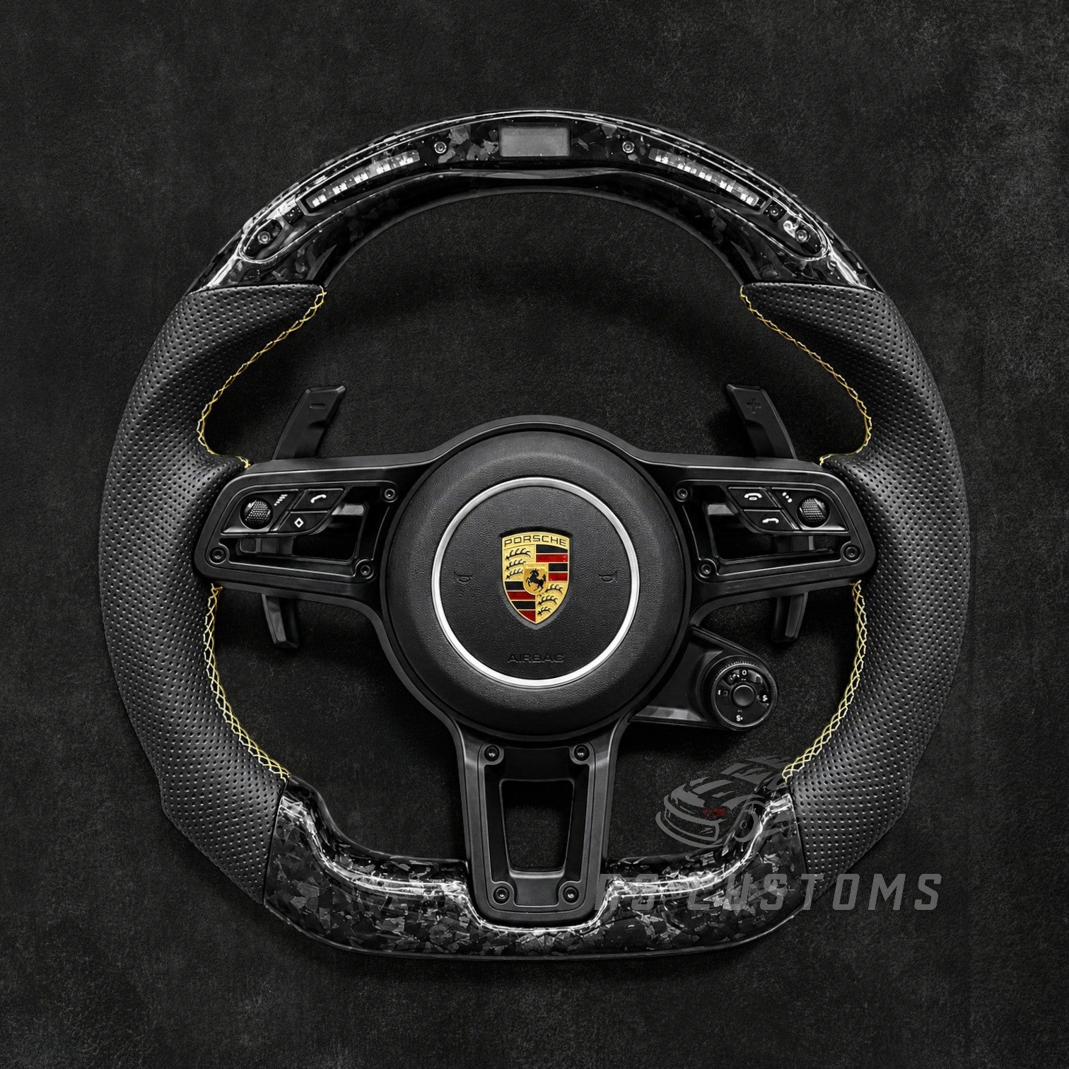 RS Customs Porsche custom steering wheel with forged carbon fiber, perforated leather, LED display, multifunction buttons and optional custom airbag for 911, Cayman, Boxster, Macan, Cayenne and Panamera models.