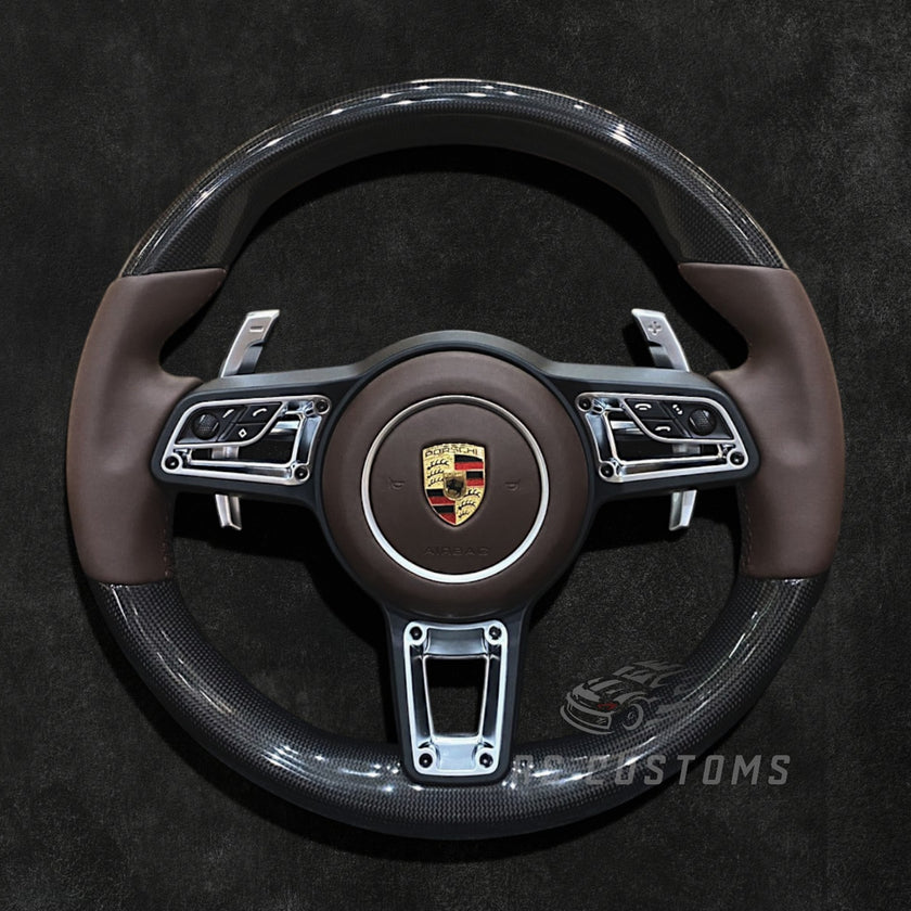 RS Customs Porsche custom steering wheel with plain weave carbon fiber, Nappa leather, multifunction buttons and optional custom airbag for 911, Cayman, Boxster, Macan, Cayenne and Panamera models.