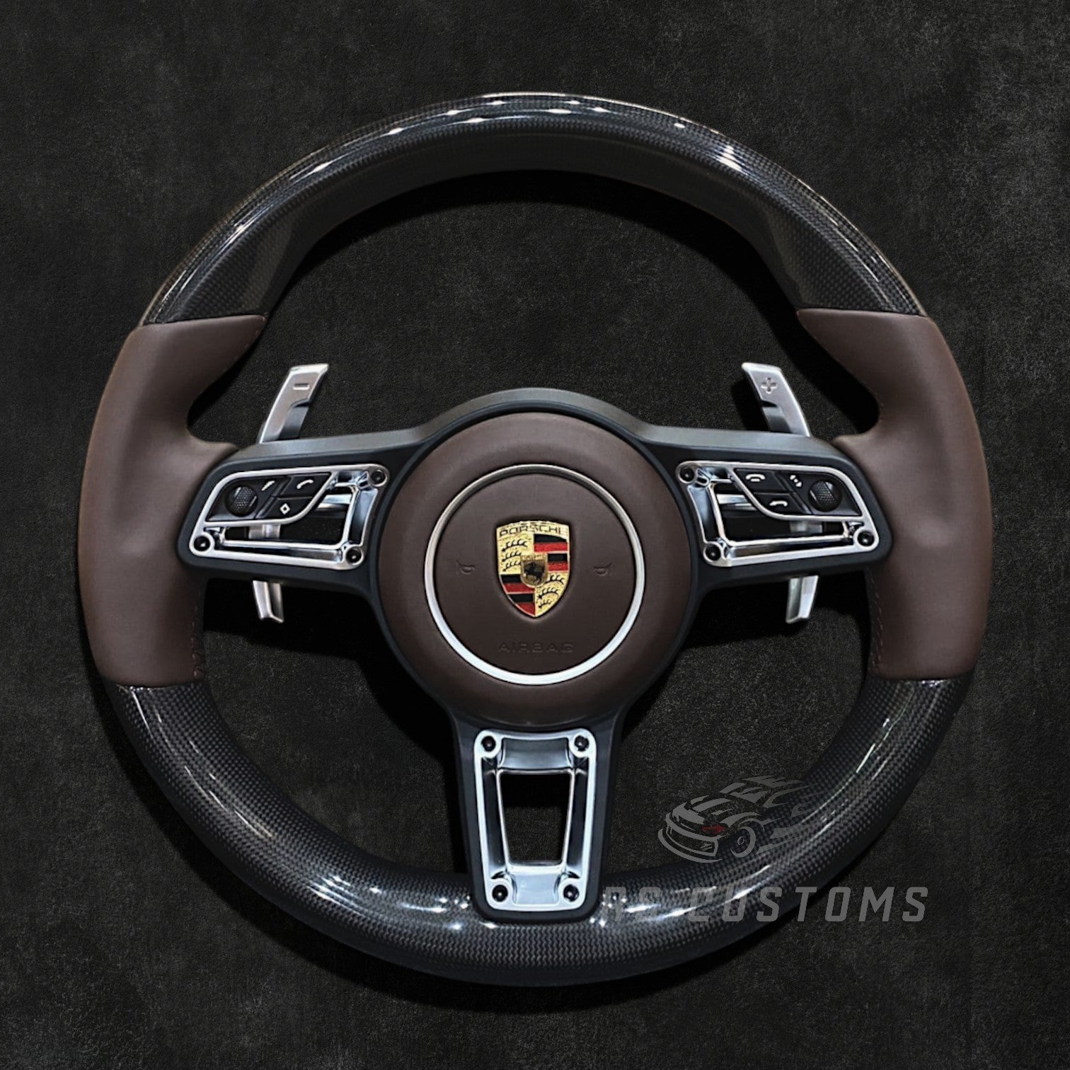 RS Customs Porsche custom steering wheel with plain weave carbon fiber, Nappa leather, multifunction buttons and optional custom airbag for 911, Cayman, Boxster, Macan, Cayenne and Panamera models.