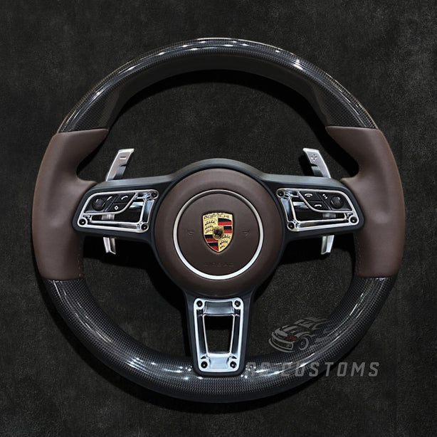 RS Customs Porsche custom steering wheel with plain weave carbon fiber, Nappa leather, multifunction buttons and optional custom airbag for 911, Cayman, Boxster, Macan, Cayenne and Panamera models.