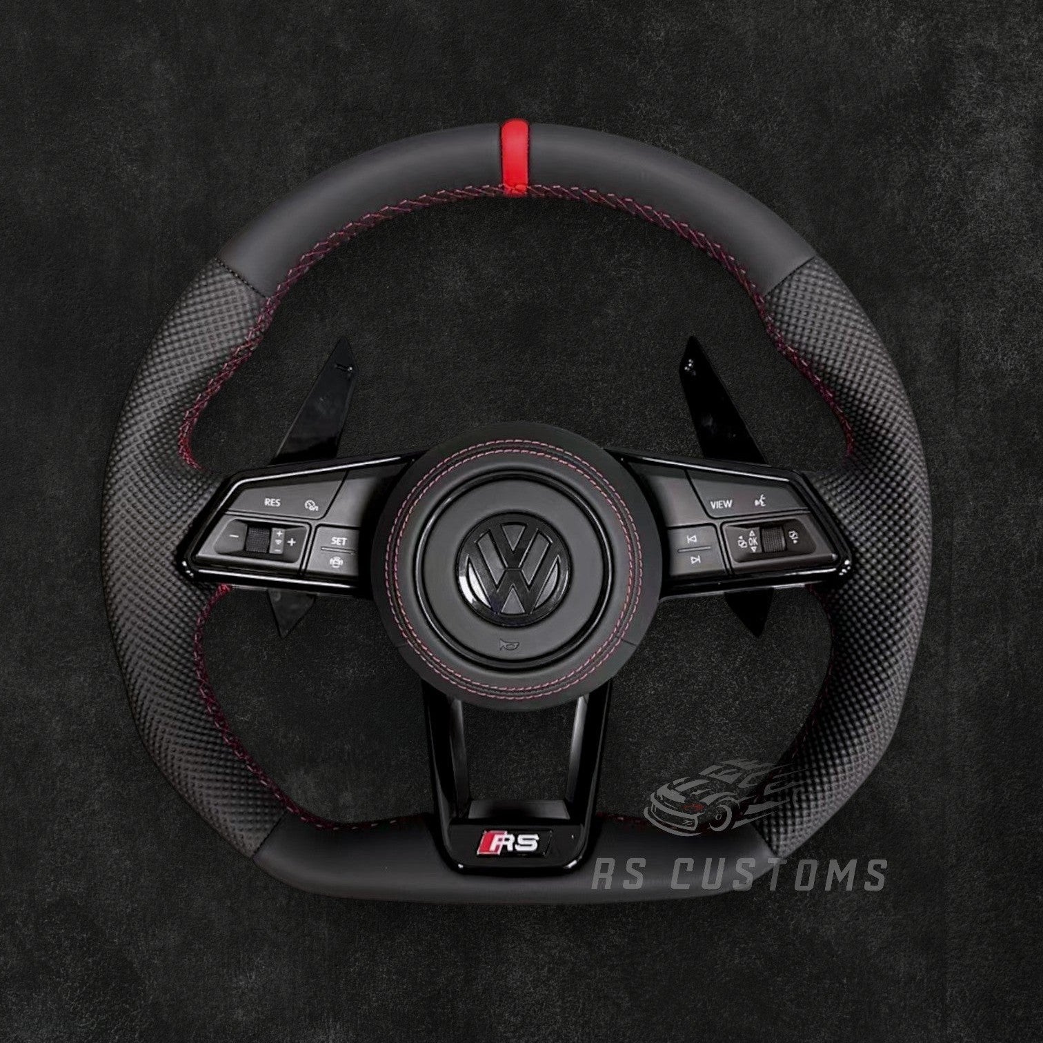 RS Customs Volkswagen RS-style custom steering wheel based on the Audi R8 and TT platform with leather finish, customizable accent colors, airbag, multifunction buttons and paddle shifters.
