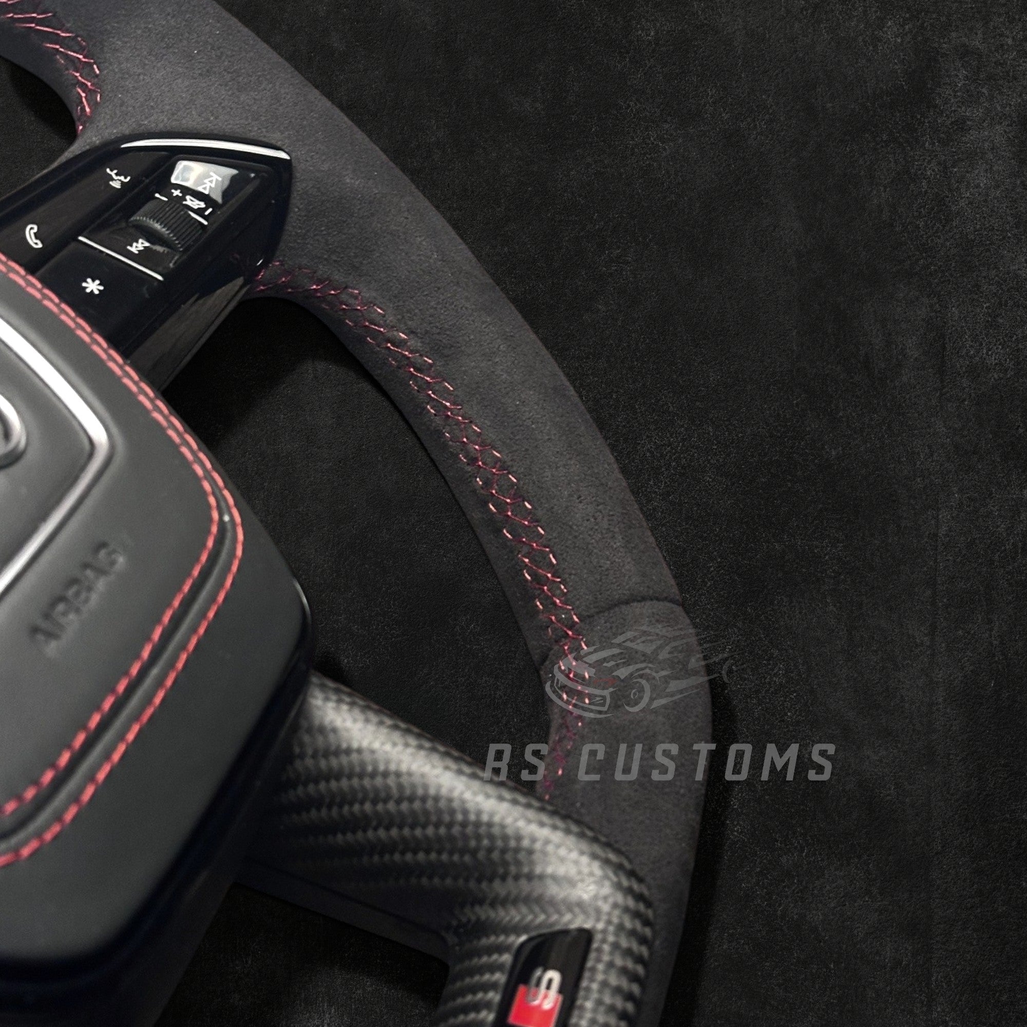RS CUSTOMS Audi RS C8 flat bottom steering wheel with Alcantara, carbon trim, and red stitching.