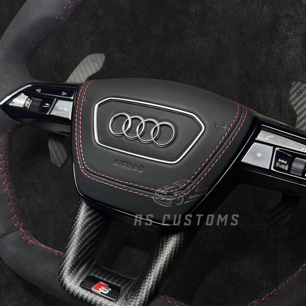RS CUSTOMS Audi RS C8 flat bottom steering wheel in black Alcantara with red stitching and carbon fiber trim.