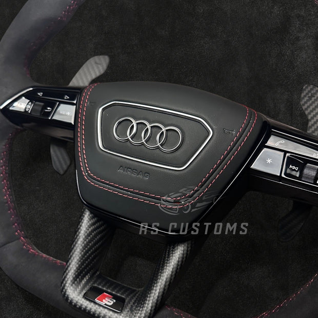 RS CUSTOMS Audi RS C8 flat bottom steering wheel in black Alcantara with red stitching and carbon fiber trim.