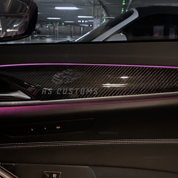 RS CUSTOMS carbon fiber interior trim kit for cars, featuring a distinctive weave pattern and high-gloss finish.