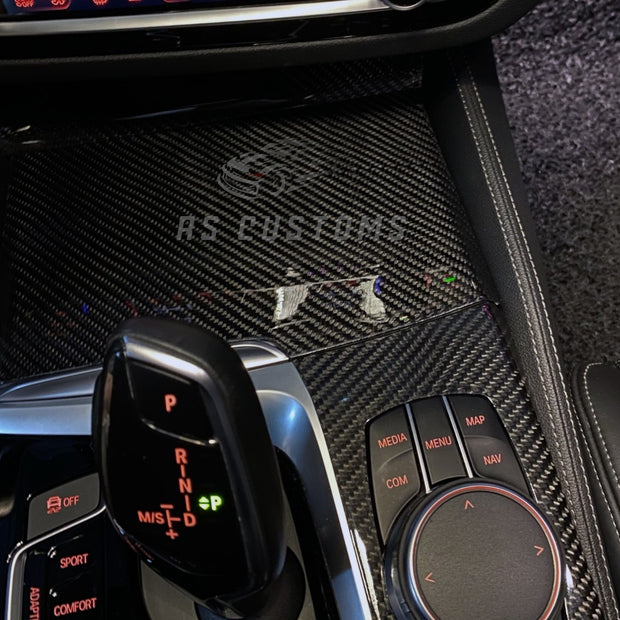 RS CUSTOMS carbon fiber interior trim kit for cars, featuring a sleek weave pattern and high-gloss finish.