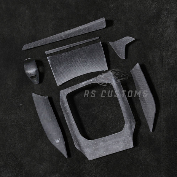 RS CUSTOMS carbon fiber interior trim kit for car dashboard and console. High-gloss finish with intricate weave pattern.
